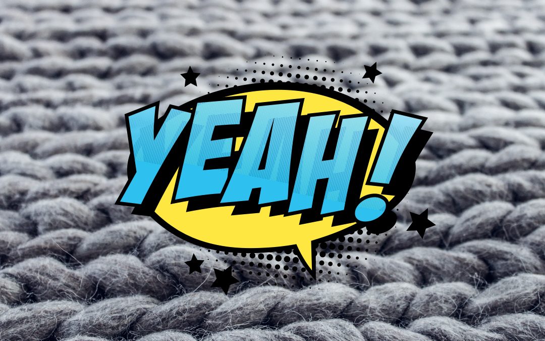 Grey, thick rug with Yeah graphic on top